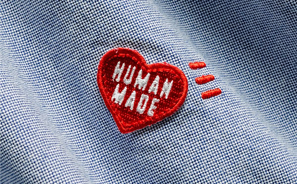 Photo d'une broderie d'un coeur où il est écrit "human made"